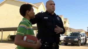 cop plays with kid