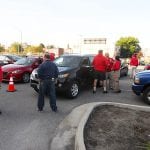 A small but steady stream of citizens line up to turn in their unwanted weapons.