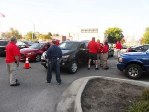 A small but steady stream of citizens line up to turn in their unwanted weapons.