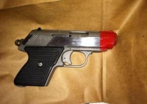 Suspect painted real gun to make it look like a toy