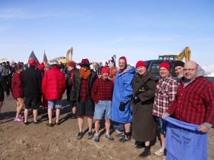 Team " Cleveland Policicles " await their turn to take the plunge into Lake Erie