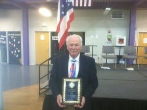Gordon Dean holding his Cleveland Police Foundation Community Service Award.