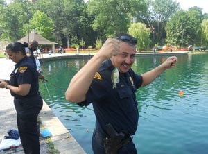 Sgt. Tim Higgins proudly showing the largest fish he caught all day.