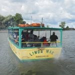 The Linda Mae heads out with an enthusiastic bunch of kids and officers.