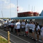 The children line up to board the Holiday fishing boat at Edgewater Park.