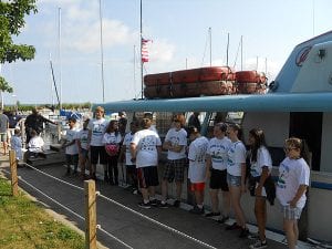 The children line up to board the Holiday fishing boat at Edgewater Park.