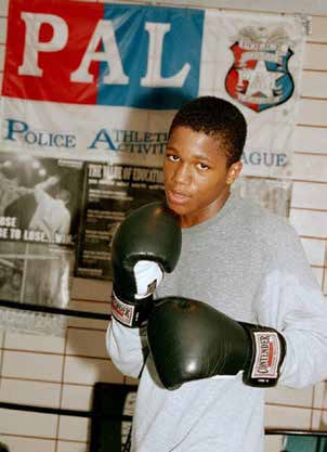 Teen wearing boxing gloves - part of the PAL program