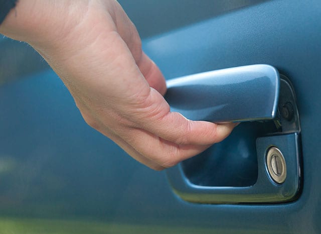 male hand opening car door