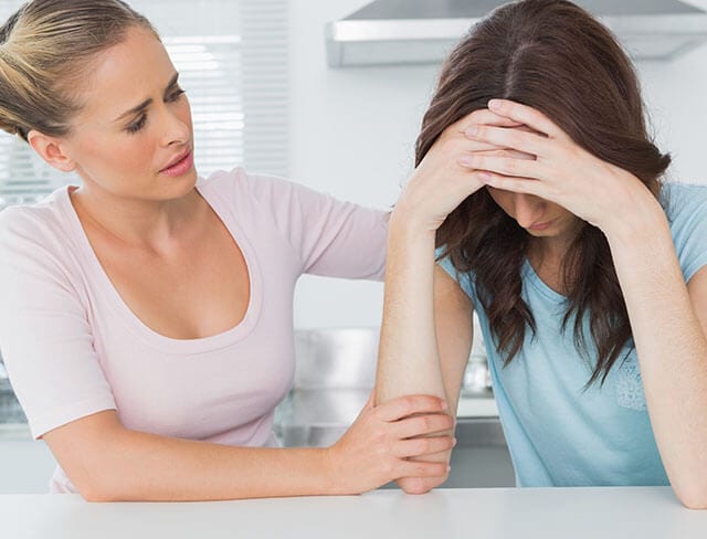 Woman comforting female friend sm