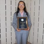 Asian Liaison Cia-Min Chen poses with her much deserved plaque.