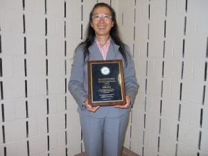 Asian Liaison Cia-Min Chen poses with her much deserved plaque.