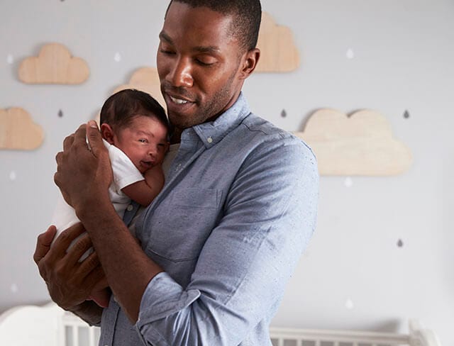 Father comforting baby