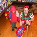 Small boy with helper at 2017 Christmas Party