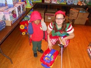 Small boy with helper at 2017 Christmas Party