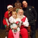 Young girl with Santa, helper and Officer at 2017 Christmas Party