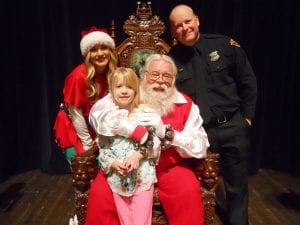 Young girl with Santa, helper and Officer at 2017 Christmas Party