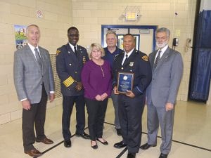 (left to right) Mike McGrath, Chief Calvin Williams, Kim Snyder, Bob Guttu, Officer Hubert Kidd, Mayor Frank Jackson.