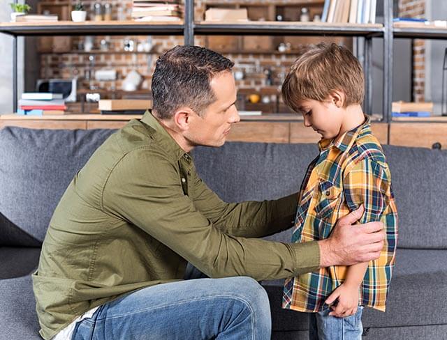 Child telling dad something