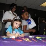 The Cleveland Police Foundation and Cops for Kids spent Saturday at Burke Lakefront Airport at the International Women's Air and Space Museum's Free Family Day. Cleveland Police officers from Community Policing and the 3rd District passed out gift bags with stuffed animals and police coloring books, crayons, and badges.