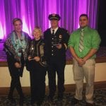 Captain Sulzer poses with his award.