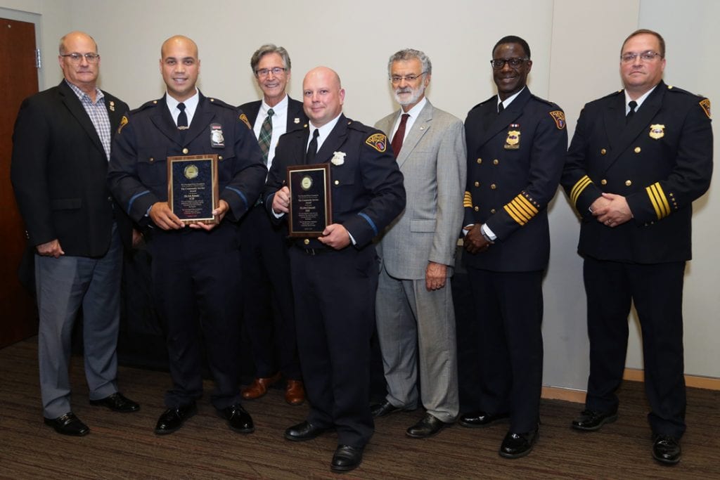 Patrol Officers Erik Melendez and John Greczanik with their Community Service Awards