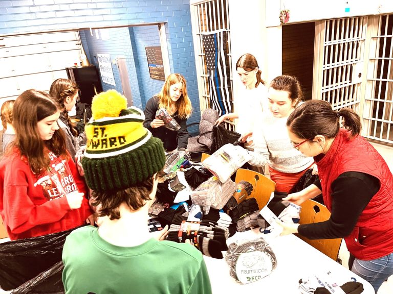 Students, officers and volunteers at the second district sock and underwear drive