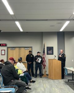 Cleveland Fire representatives stand by as a CFD speaker presents at the District 3 meeting.