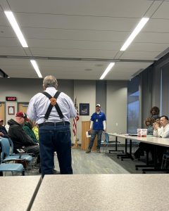 Community member speaks during the District 3 Policing Committee meeting as city staff listen.