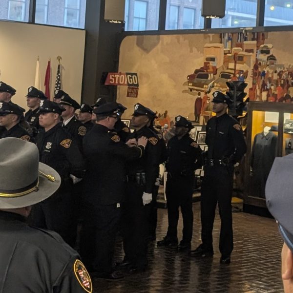 New Cleveland Police officers receive their badges during a pinning ceremony held at the Cleveland Police Museum.