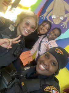 Officers Lavender and Simpson take a cheerful selfie with Buhrer students