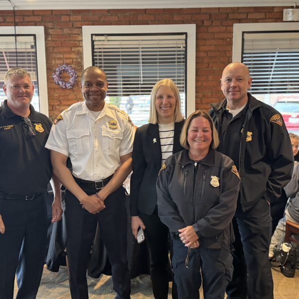Officers pose for a photo with Councilmember Jenny Spencer and First District leadership