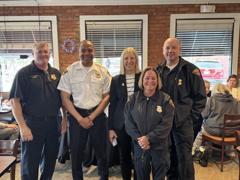 Officers pose for a photo with Councilmember Jenny Spencer and First District leadership