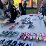 Table of colorful sunglasses set up for giveaway