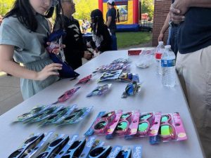 Table of colorful sunglasses set up for giveaway