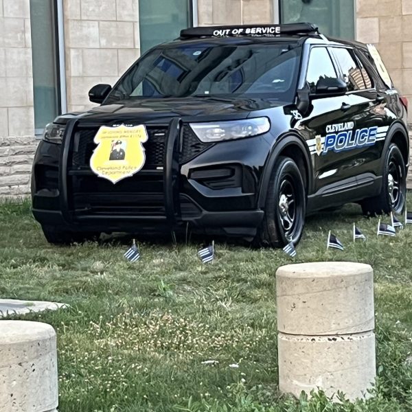 A Cleveland Police patrol vehicle marked “Out of Service” and decorated in memory of Officer Jamieson Ritter.