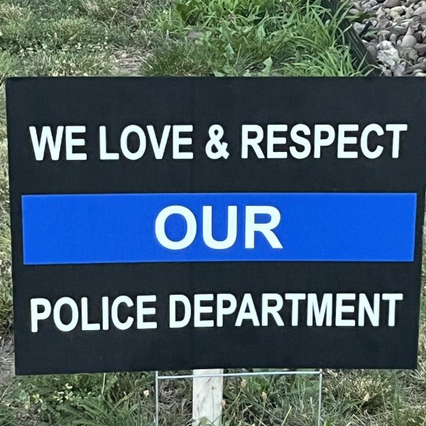Sign reading “We Love & Respect Our Police Department” placed outside the 3rd District.