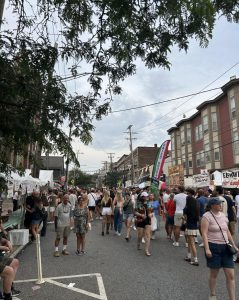 Crowds fill Mayfield Road lined with food stands and vendor tents during the Feast of the Assumption in Little Italy.