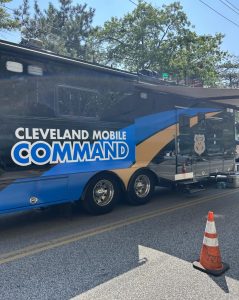 The Cleveland Police Division’s large blue-and-gold Mobile Command vehicle is parked on the street during the Feast of the Assumption.