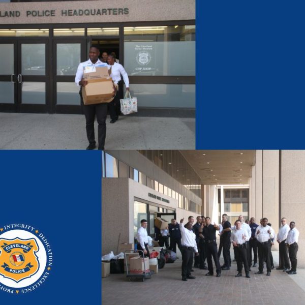 Recruits carry boxes and bags of donations out of Cleveland Police Headquarters, gathering in groups around piles of collected items.