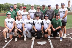 Cleveland Fire softball team posing together on the field before the Police/Fire game.