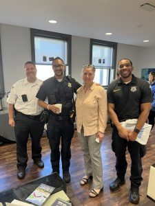 Group of officers and community members at The Foundry Coffee with a Cop