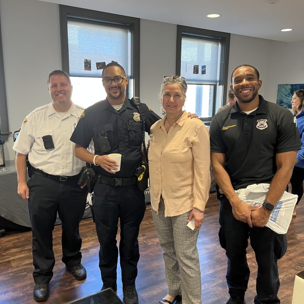 Group of officers and community members at The Foundry Coffee with a Cop