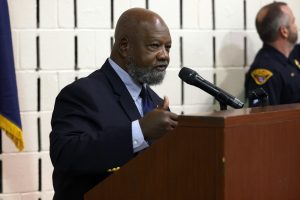 Harry Boomer speaking at the podium during the ceremony.