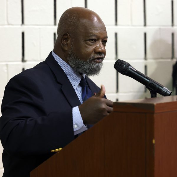 Harry Boomer speaking at the podium during the ceremony.