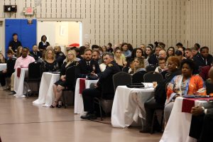 Audience members seated at tables during the awards ceremony.