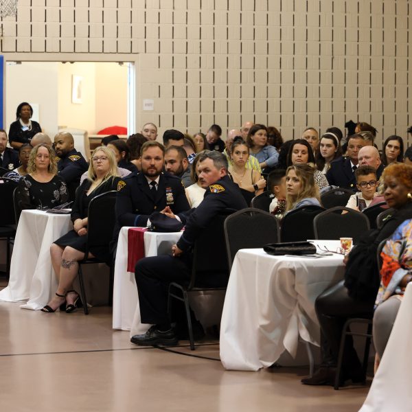 Audience members seated at tables during the awards ceremony.