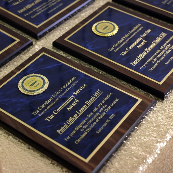 Close-up of Cleveland Police Foundation Community Service Award plaques.