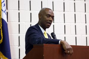 Public Safety Director Wayne Drummond speaking at the podium during the awards ceremony.