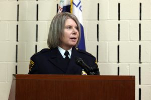 Chief Dorothy Todd speaking at the podium during the Third District Community Awards Ceremony at Fatima Family Center.