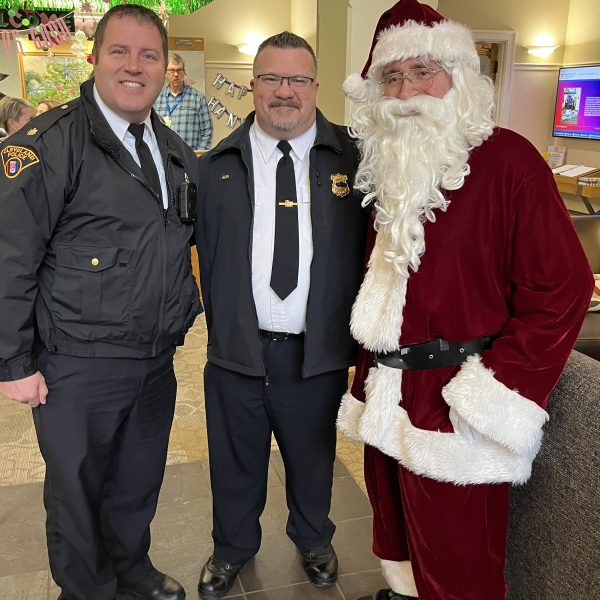 Cleveland police officers pose with Santa Claus during the Cops, Kids & Christmas event.